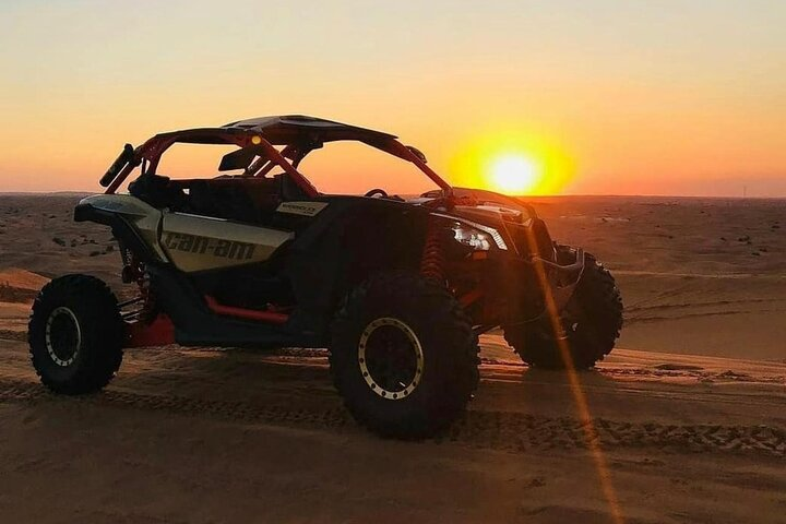 Explore the vast desert landscape with friends uncovering hidden gems and rocky terrains as the sun sets creating a perfect backdrop for unforgettable adventures.